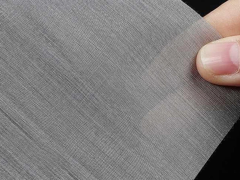Stainless steel plain weave wire mesh with uniform square openings, available in rolls and sheets for industrial filtration and screening.